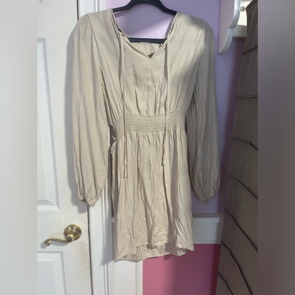 Cream colored dress with open back cut outs
